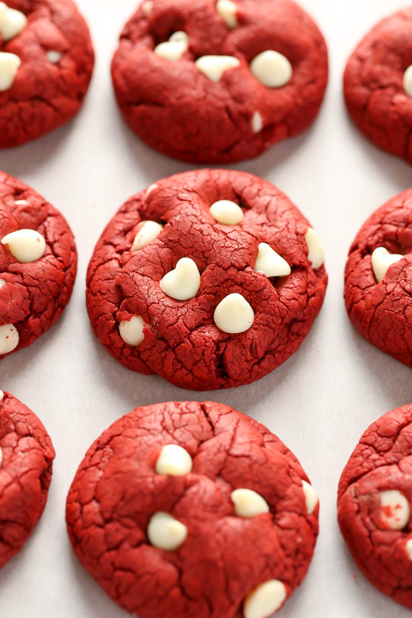 Three rows of white chocolate chip red velvet cookies. 